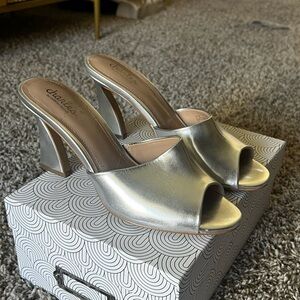 C. David Silver Heeled Mules